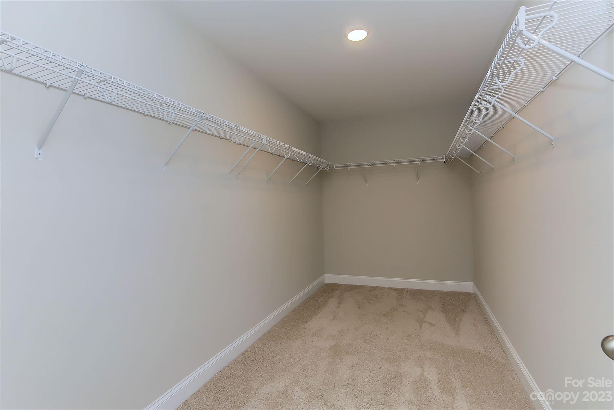 11266 Trailside Road Concord, NC 28027 - Photo 31 of 45 a view of an empty walk in closet