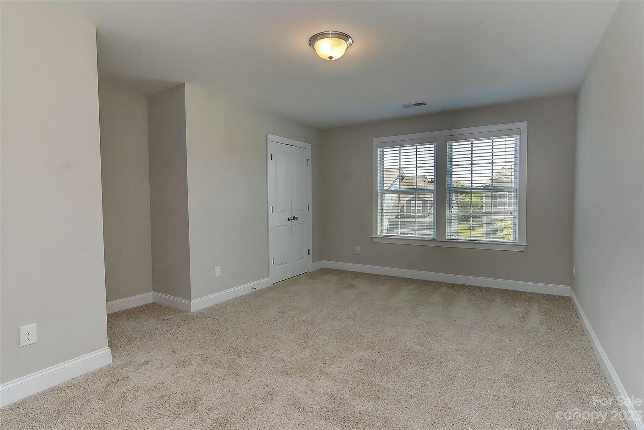 11266 Trailside Road Concord, NC 28027 - Photo 38 of 45 an empty room with a empty space and windows