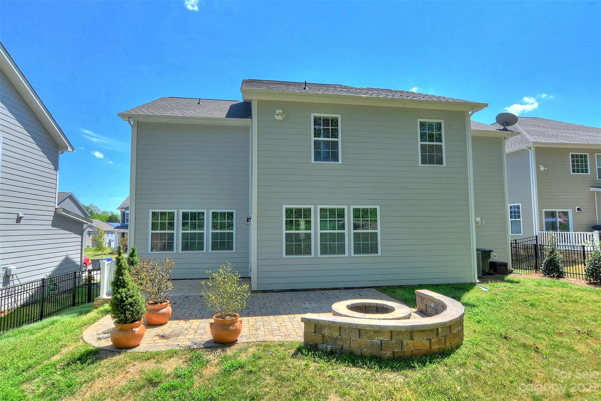 11266 Trailside Road Concord, NC 28027 - Photo 43 of 45 a backyard of a house with a garden and fire pit