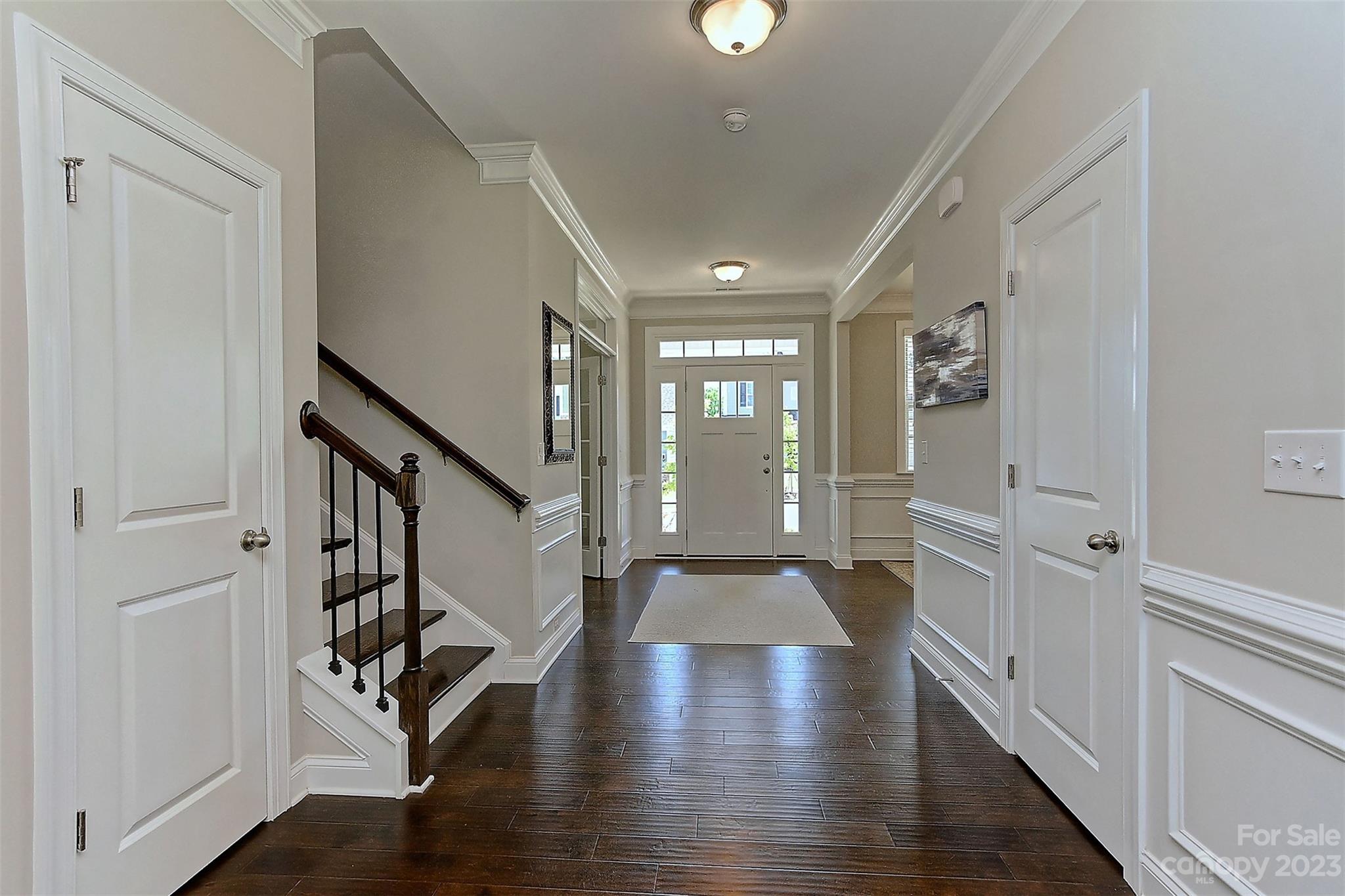 11266 Trailside Road Concord, NC 28027 - Photo 6 of 45 a view of a hallway with wooden floor and stairs