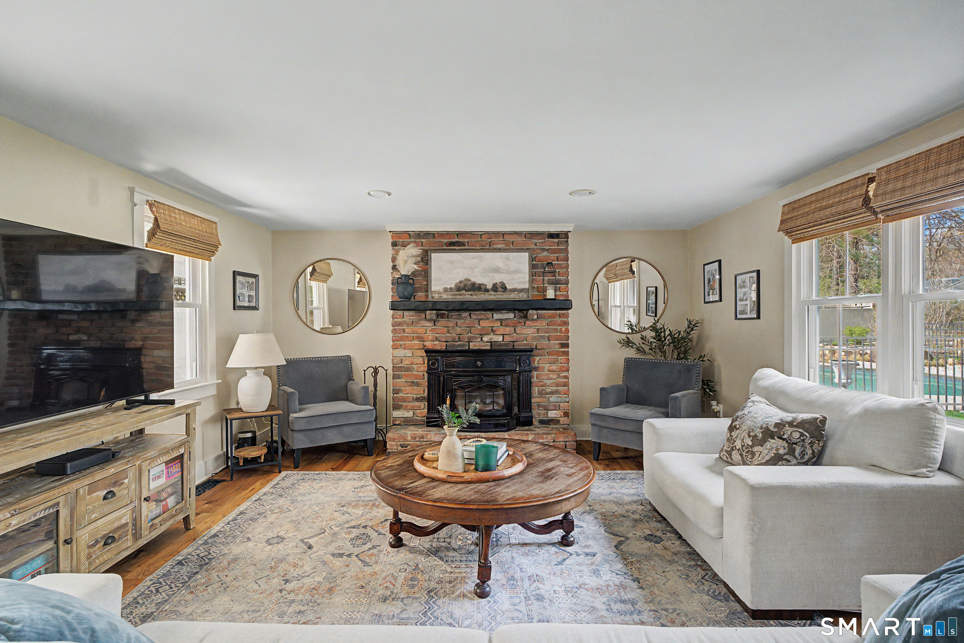 602 Durham Road Madison, CT 06443 - Photo 8 of 34 Oversized family room with wood burning fireplace