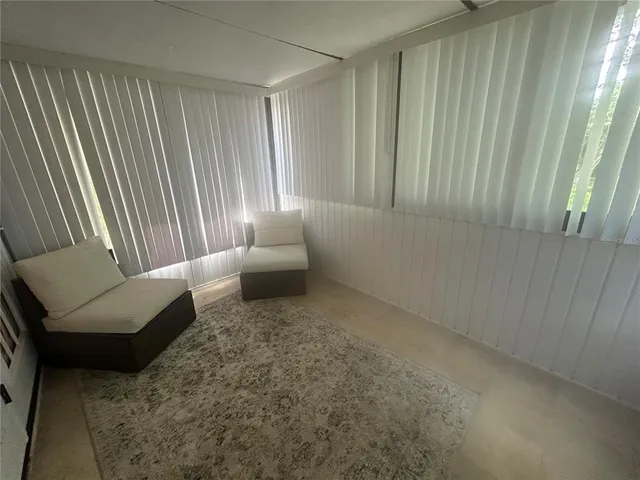 a living room with furniture and a gate