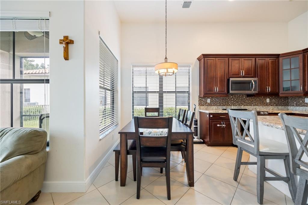 5116 Salerno Street Ave Maria, FL 34142 - Photo 13 of 36 a dining room with furniture and window