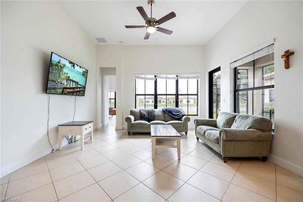 5116 Salerno Street Ave Maria, FL 34142 - Photo 15 of 36 a living room with furniture and a flat screen tv