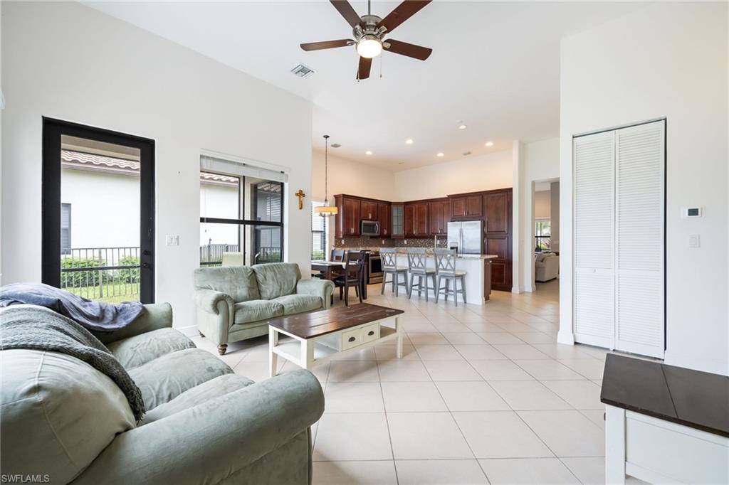 5116 Salerno Street Ave Maria, FL 34142 - Photo 17 of 36 a living room with furniture and a large window