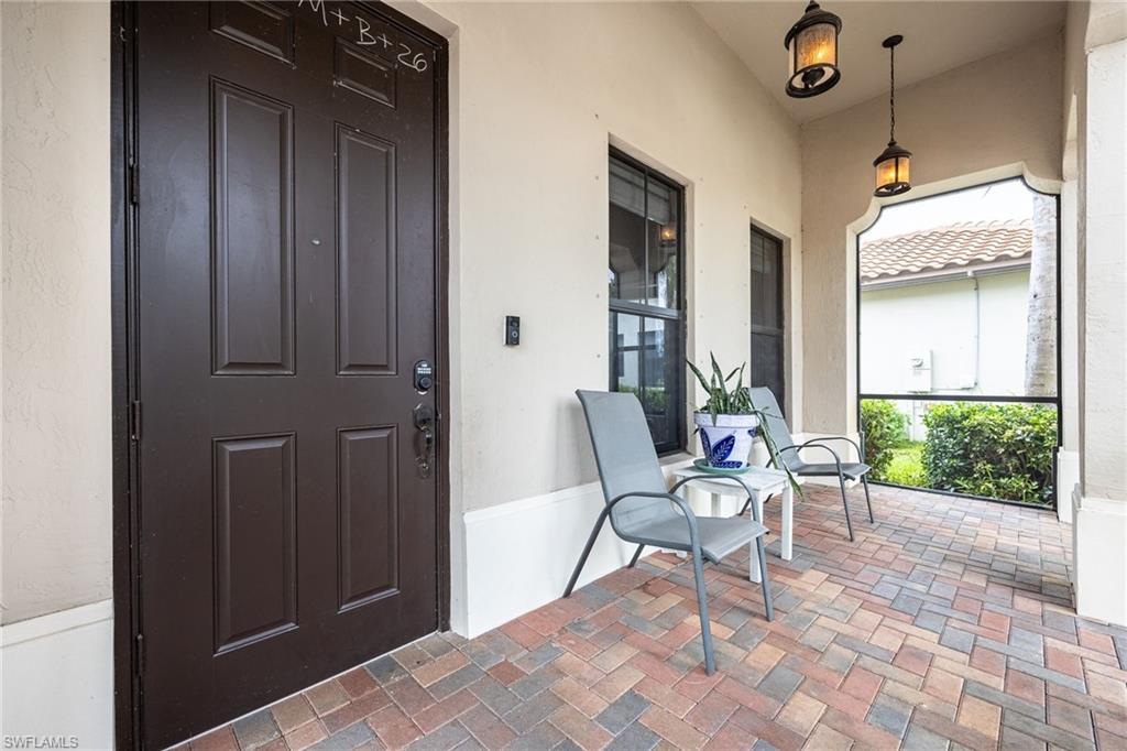 5116 Salerno Street Ave Maria, FL 34142 - Photo 2 of 36 a chair and a table in a room