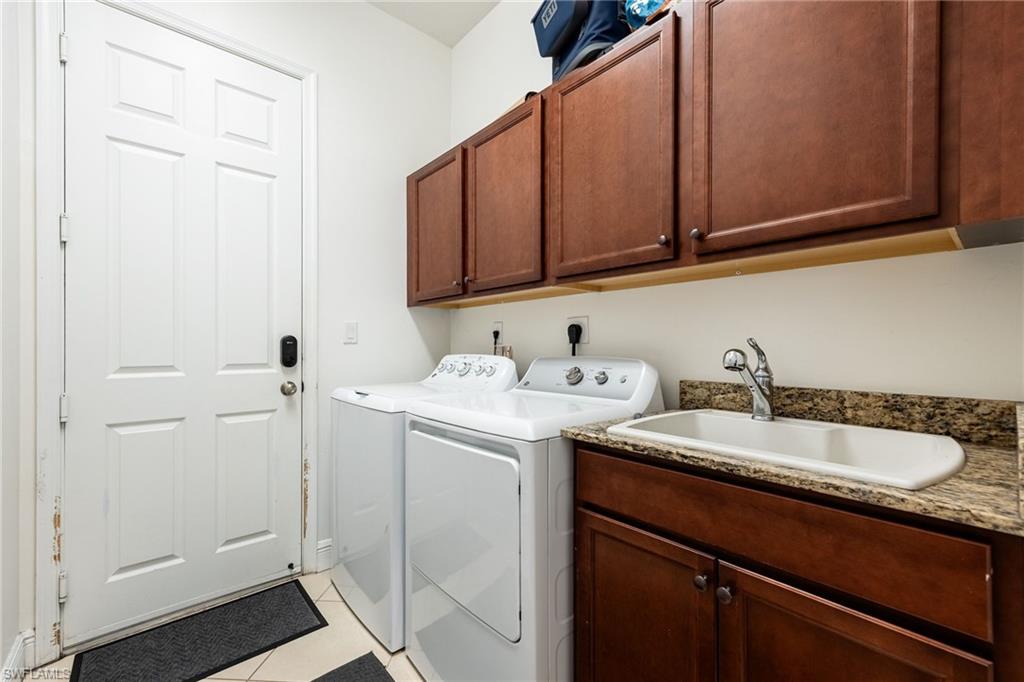 5116 Salerno Street Ave Maria, FL 34142 - Photo 26 of 36 a utility room with sink dryer and washer