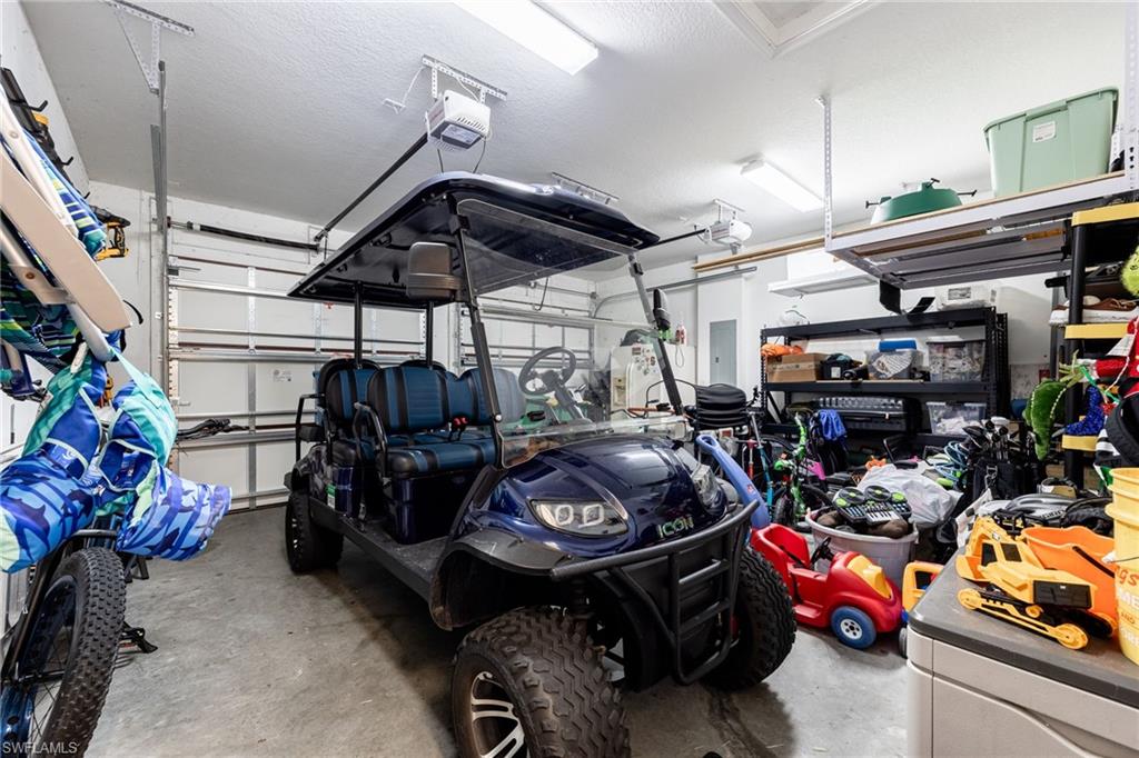 5116 Salerno Street Ave Maria, FL 34142 - Photo 27 of 36 a car and bike garage