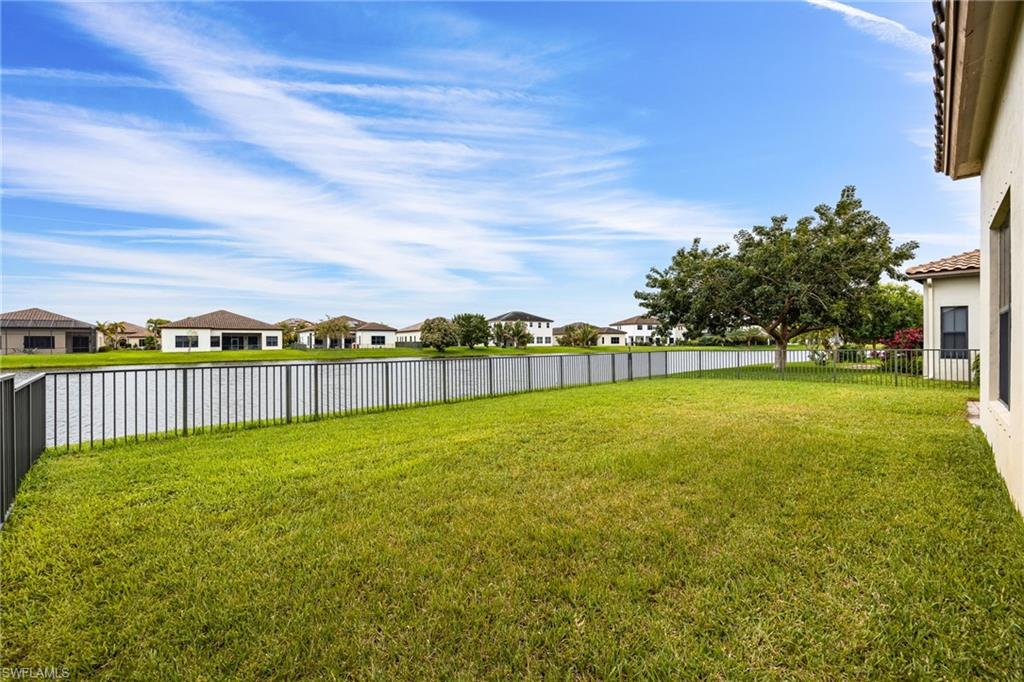 5116 Salerno Street Ave Maria, FL 34142 - Photo 30 of 36 a view of a green field