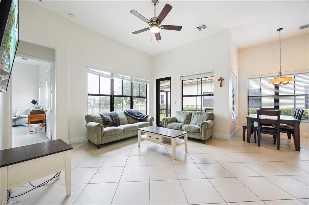 5116 Salerno Street Ave Maria, FL 34142 - Photo 8 of 36 a living room with furniture and a large window
