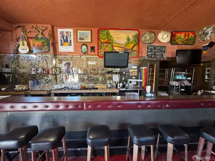 a view of a cafe with sitting area