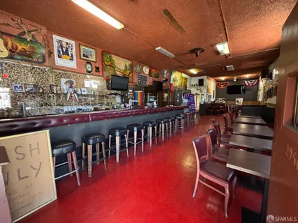 a view of a chairs and tables in a patio