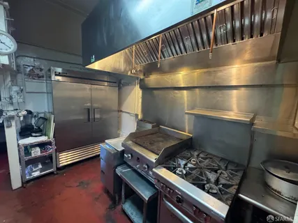 a kitchen with storage and utility