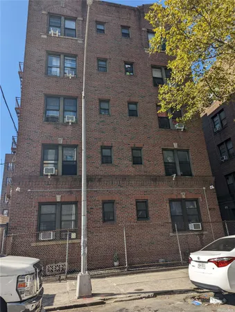 a front view of a building with a street