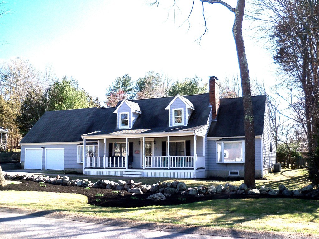 8 Hillcrest Road Canton, MA 02021 - Photo 1 of 29 a front view of a house with a garden and lake view