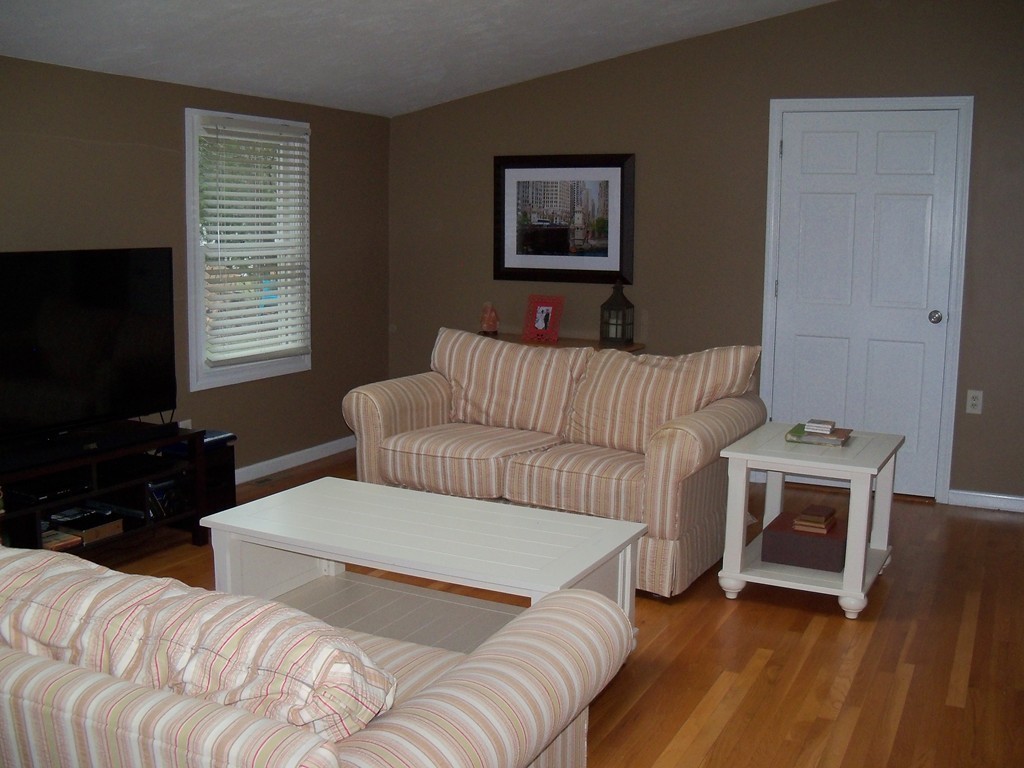 8 Hillcrest Road Canton, MA 02021 - Photo 11 of 29 a living room with furniture and a flat screen tv