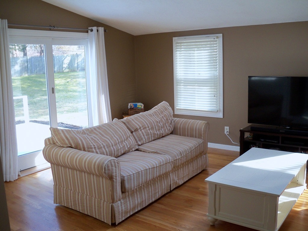 8 Hillcrest Road Canton, MA 02021 - Photo 12 of 29 a living room with couches and a flat screen tv