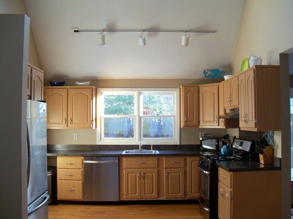 8 Hillcrest Road Canton, MA 02021 - Photo 14 of 29 a kitchen with granite countertop a sink and a refrigerator