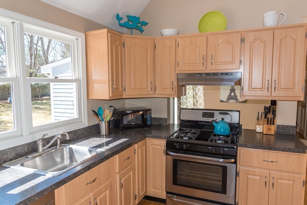 8 Hillcrest Road Canton, MA 02021 - Photo 15 of 29 a kitchen with granite countertop a stove a sink and a granite counter tops