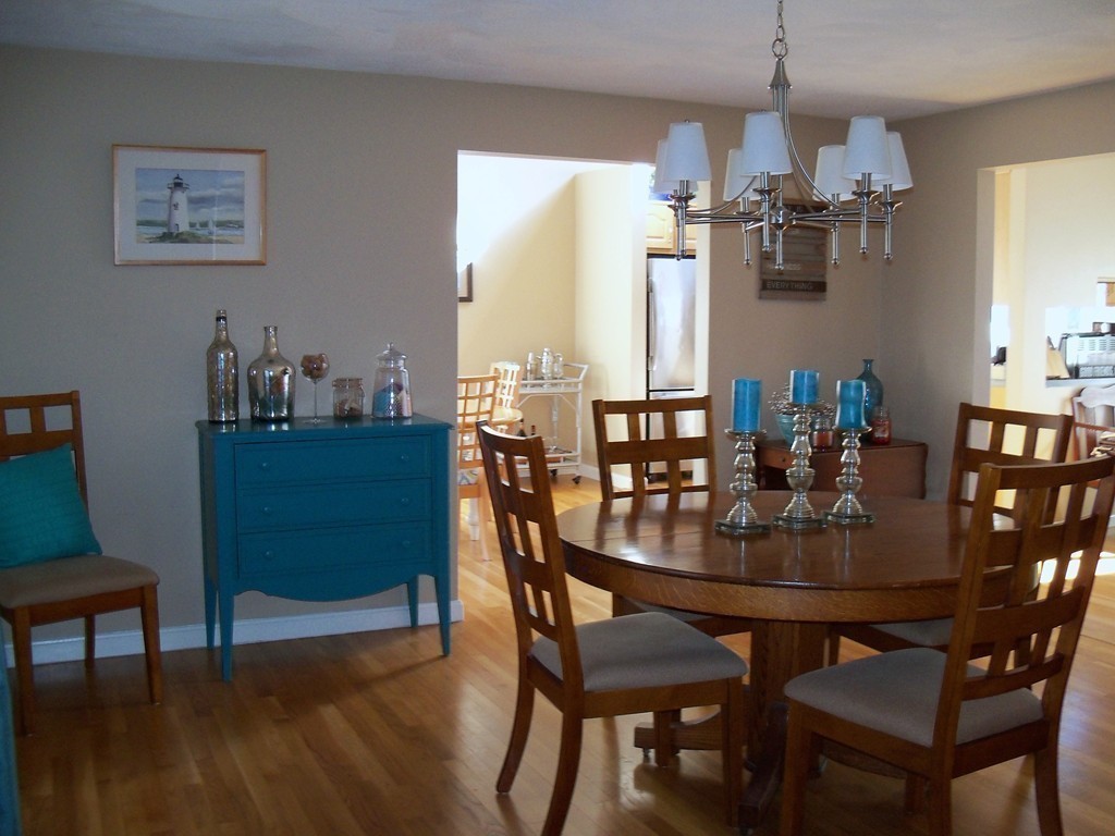 8 Hillcrest Road Canton, MA 02021 - Photo 17 of 29 a dining room with furniture a chandelier and wooden floor