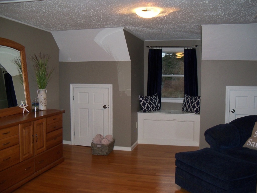 8 Hillcrest Road Canton, MA 02021 - Photo 24 of 29 a living room with furniture and a flat screen tv