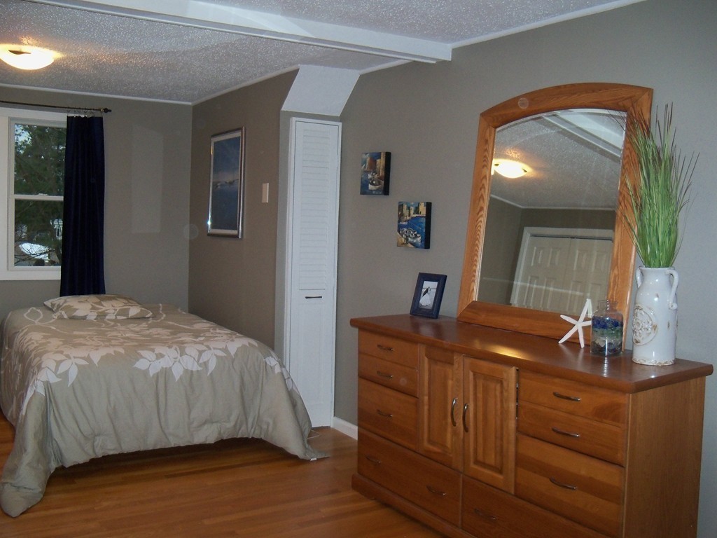 8 Hillcrest Road Canton, MA 02021 - Photo 25 of 29 a bedroom with a bed and a mirror
