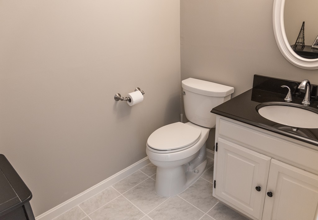 8 Hillcrest Road Canton, MA 02021 - Photo 28 of 29 a bathroom with a granite countertop toilet and a sink