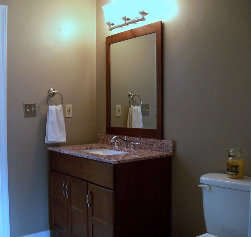 8 Hillcrest Road Canton, MA 02021 - Photo 29 of 29 a bathroom with a granite countertop sink and a mirror