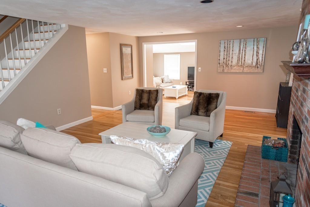 8 Hillcrest Road Canton, MA 02021 - Photo 8 of 29 a living room with furniture and a fireplace