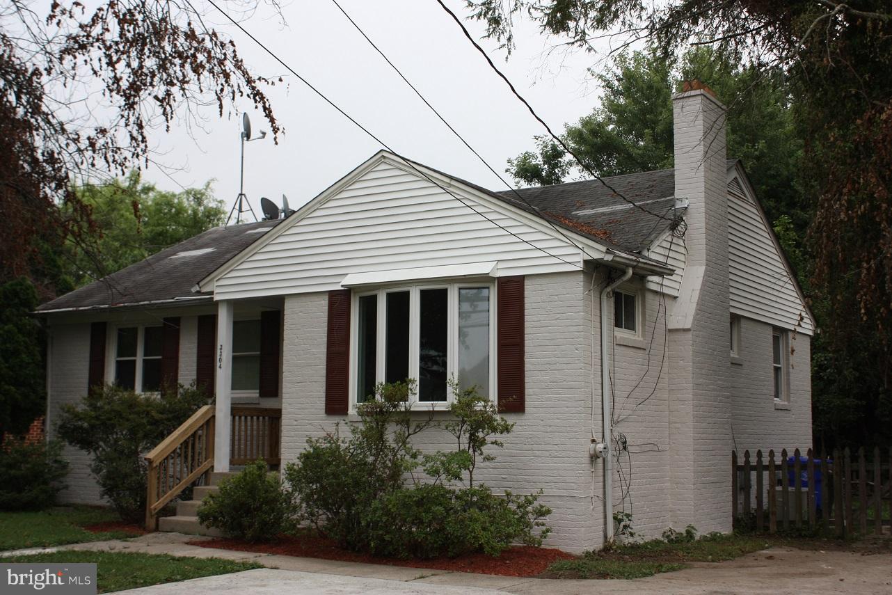 3304 Randolph Road Silver Spring, MD 20902 - Photo 1 of 22 a view of small white house with a small yard and potted plants