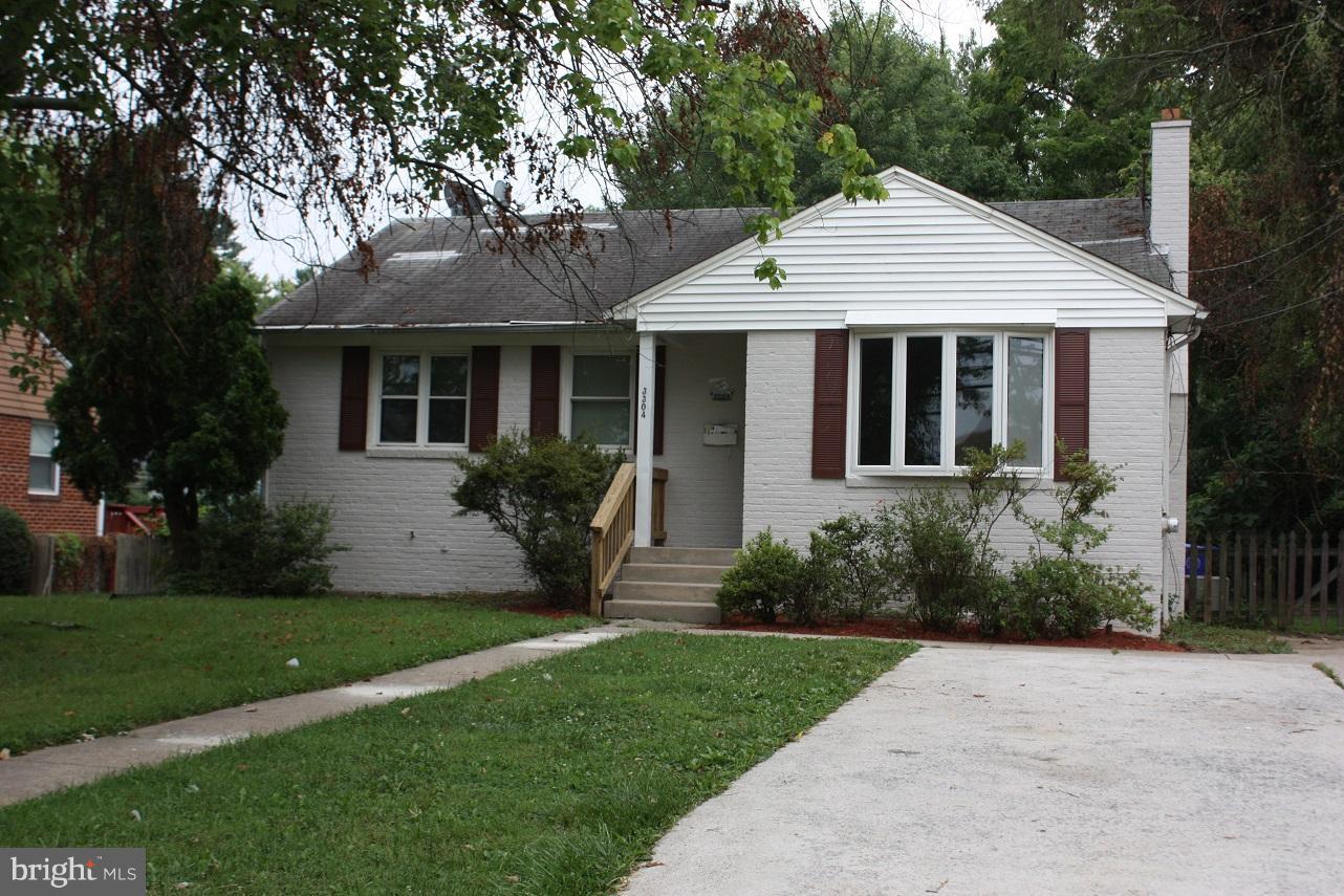 3304 Randolph Road Silver Spring, MD 20902 - Photo 2 of 22 a front view of a house with a yard and potted plants