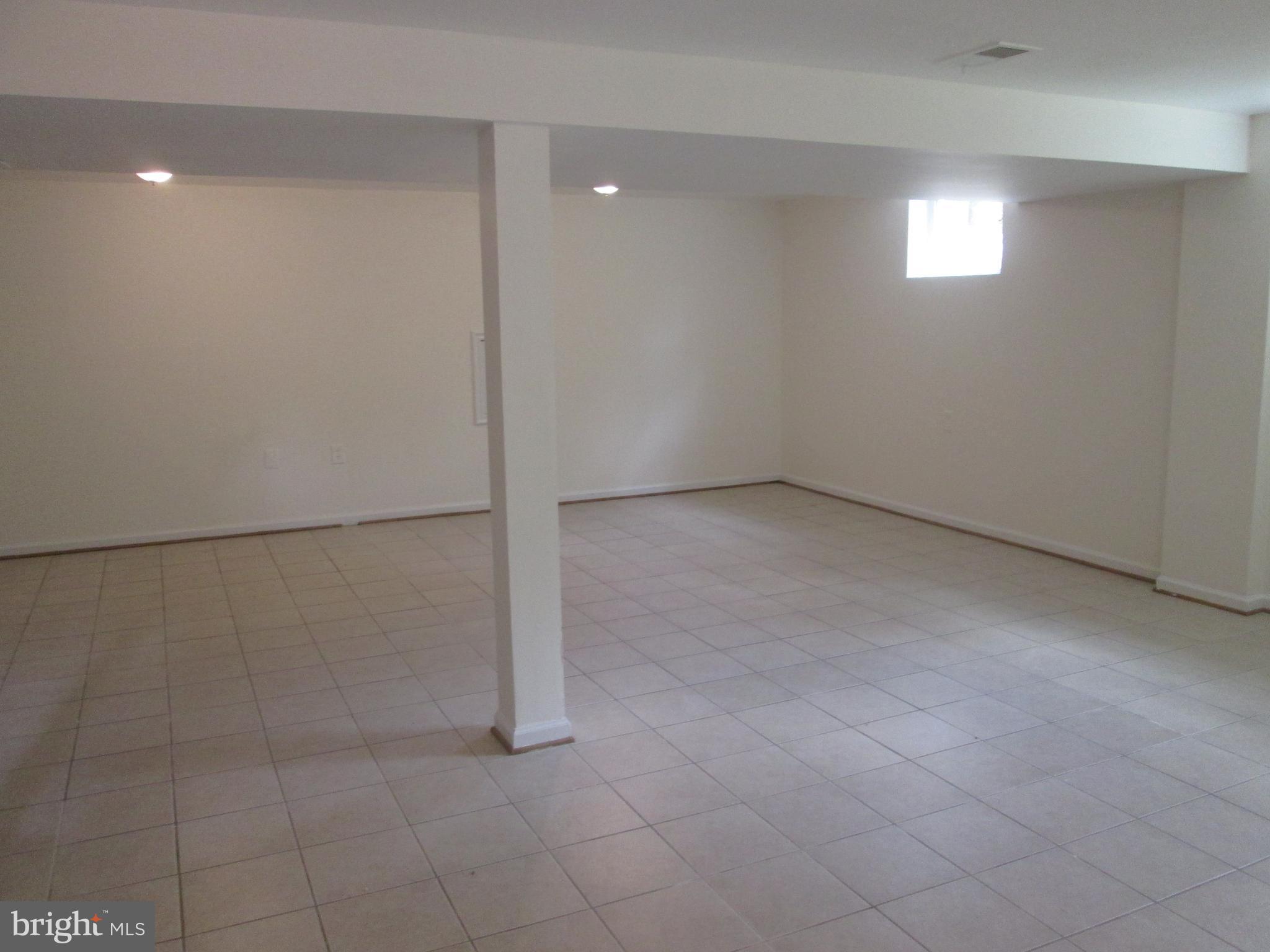 3304 Randolph Road Silver Spring, MD 20902 - Photo 17 of 22 an empty room with white walls and tiles
