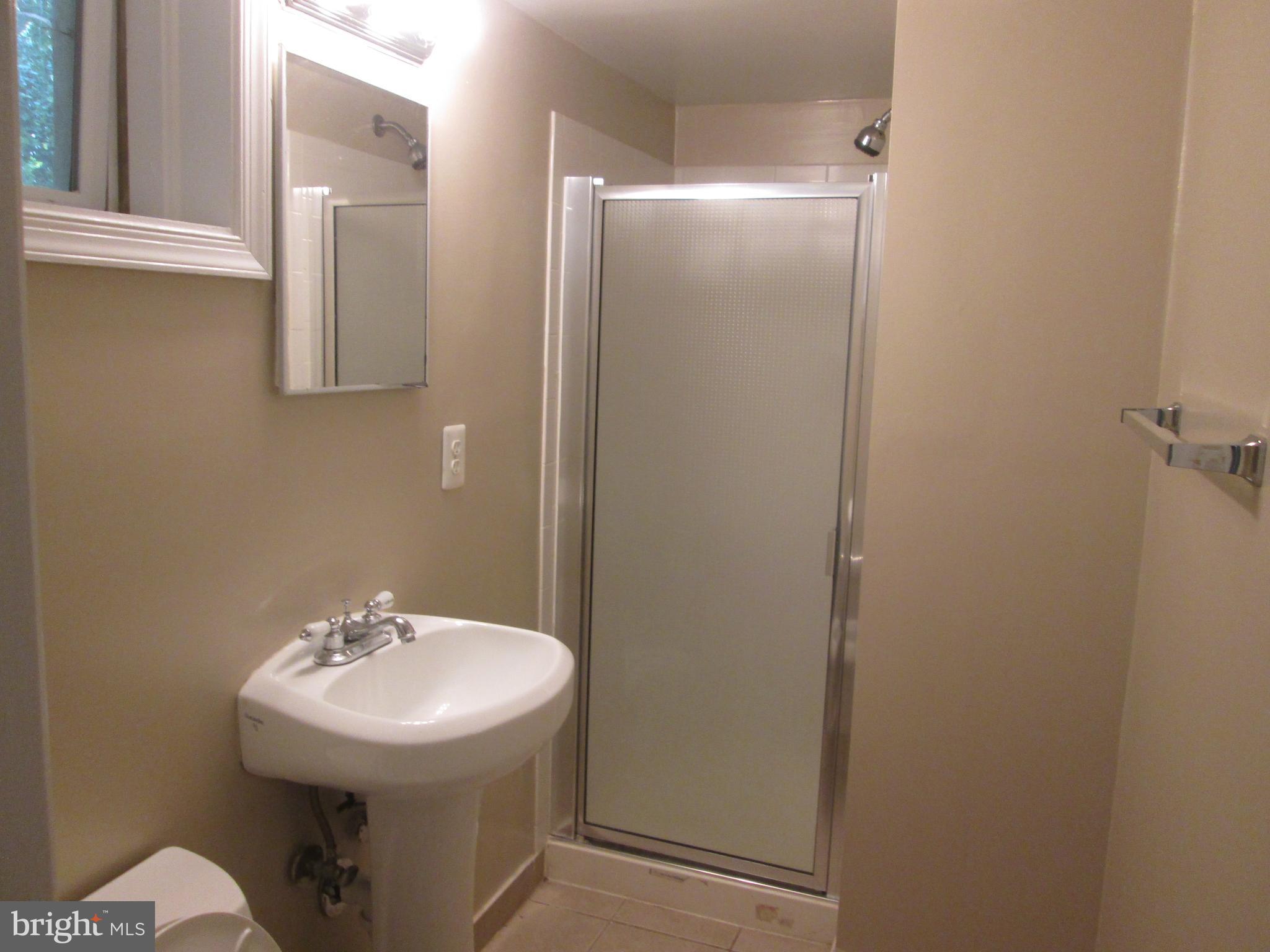 3304 Randolph Road Silver Spring, MD 20902 - Photo 18 of 22 a bathroom with a sink and mirror