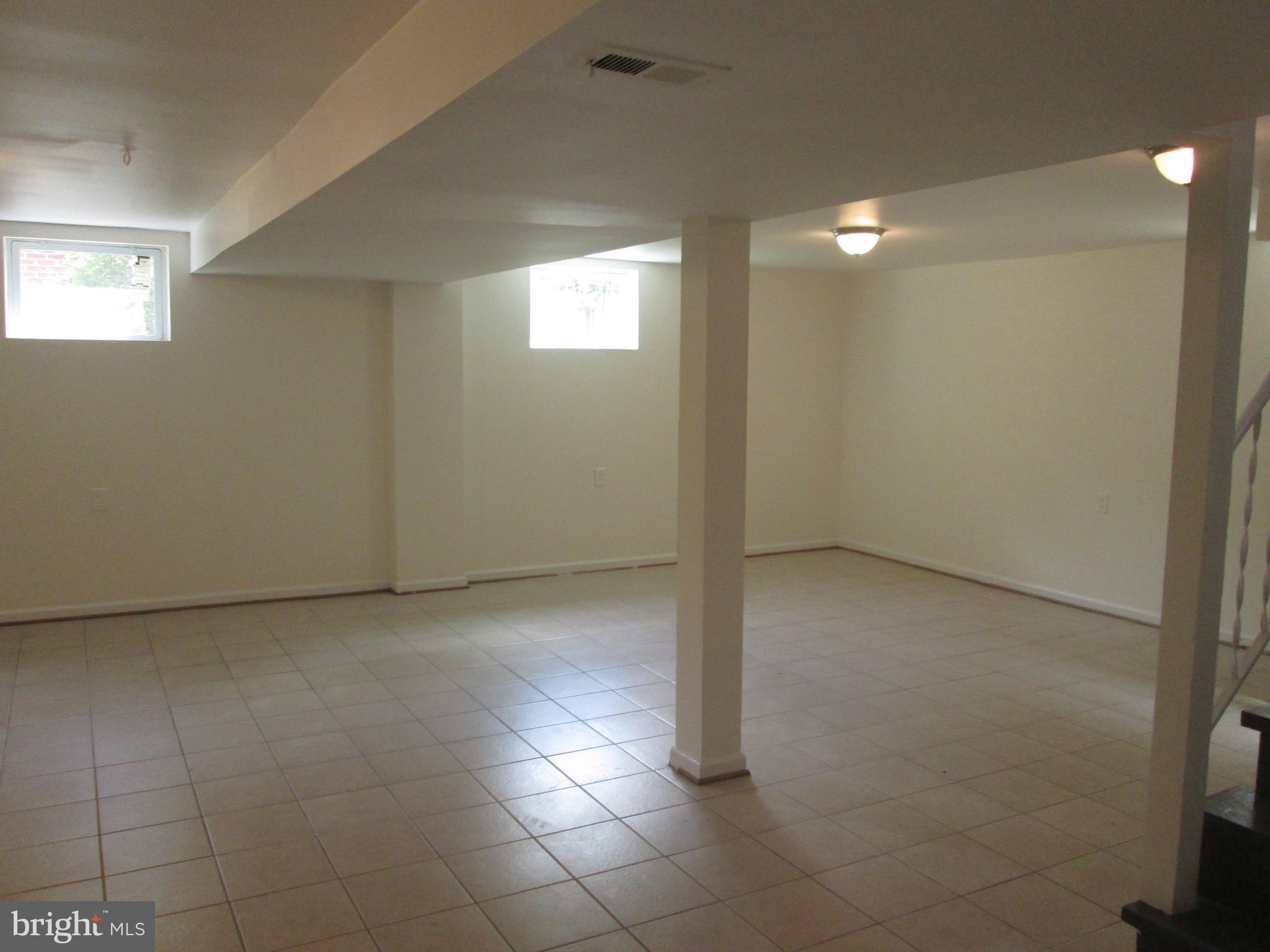 3304 Randolph Road Silver Spring, MD 20902 - Photo 20 of 22 a view of an empty room with window and chandelier fan