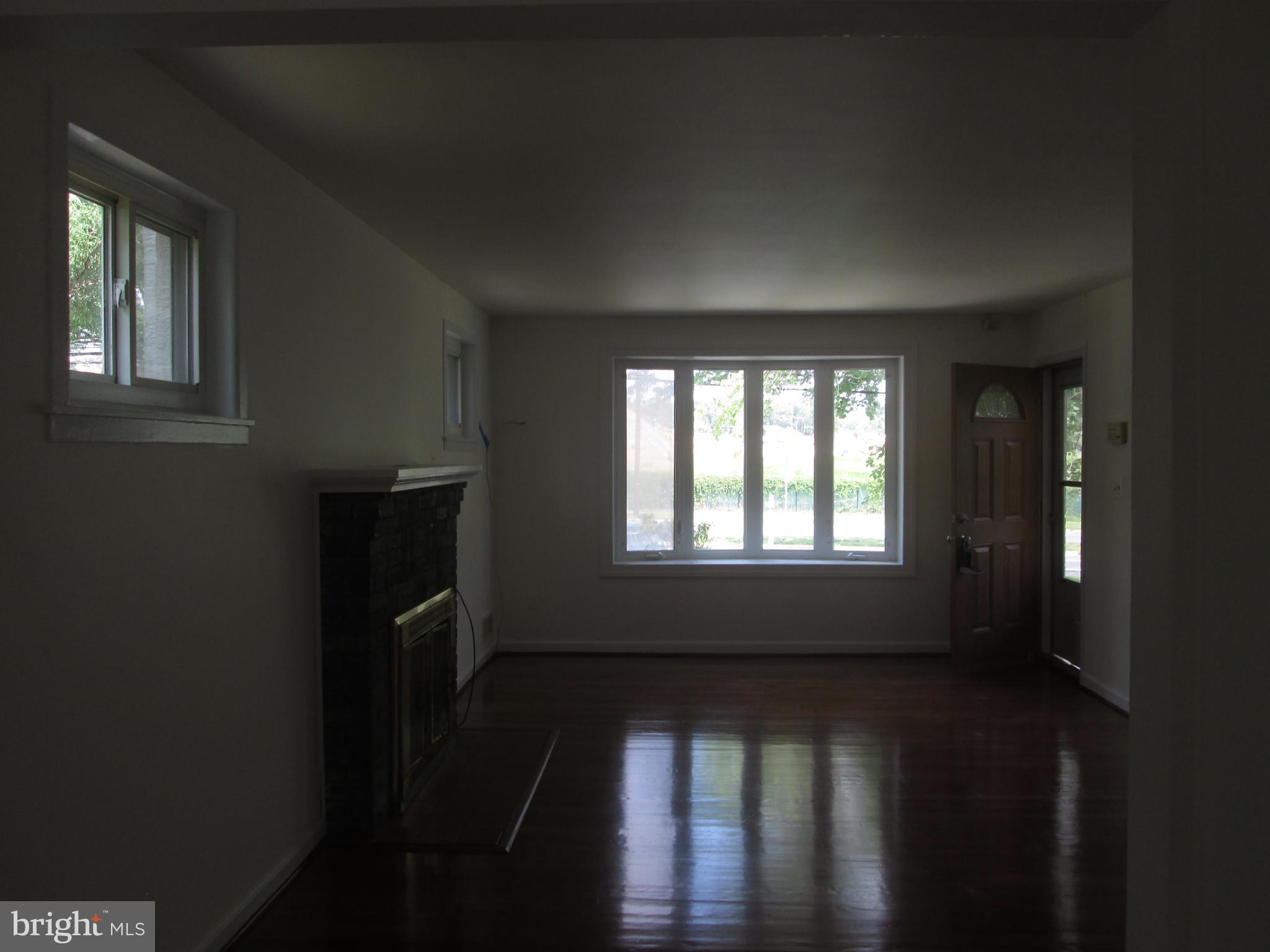 3304 Randolph Road Silver Spring, MD 20902 - Photo 22 of 22 a view of a livingroom with wooden floor and a window