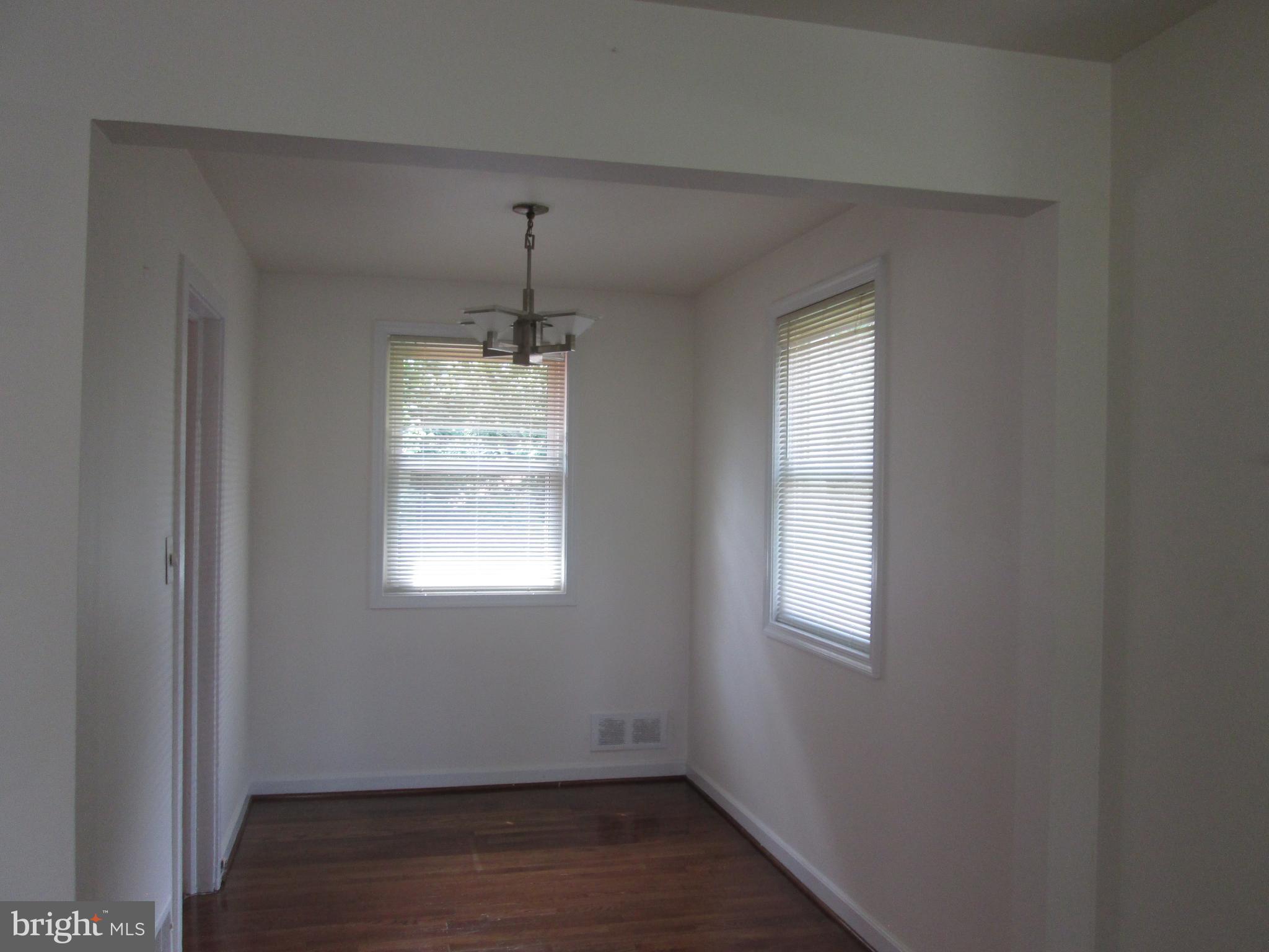 3304 Randolph Road Silver Spring, MD 20902 - Photo 10 of 22 an empty room with wooden floor and windows