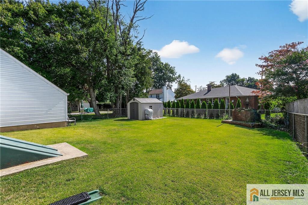 529 4th Street Dunellen, NJ 08812 - Photo 19 of 25 a view of a house with pool and a yard