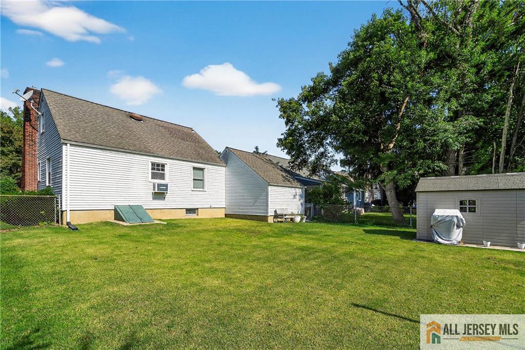 529 4th Street Dunellen, NJ 08812 - Photo 20 of 25 a view of a house with a backyard