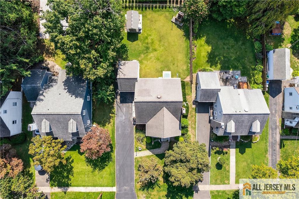 529 4th Street Dunellen, NJ 08812 - Photo 2 of 25 an aerial view of a house with swimming pool and green space