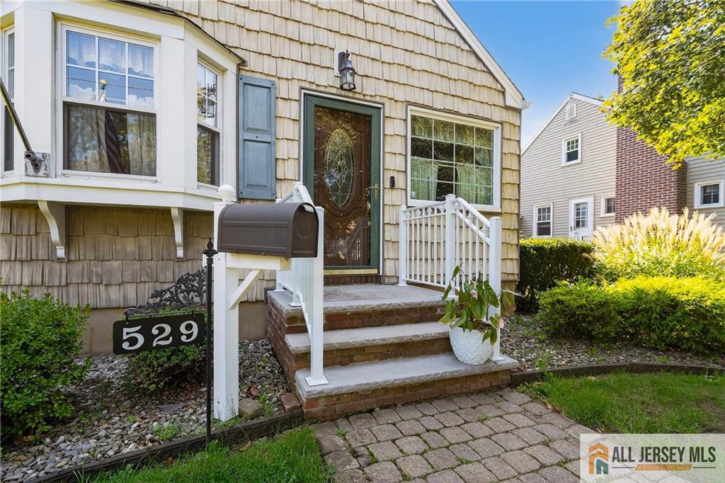 529 4th Street Dunellen, NJ 08812 - Photo 4 of 25 a front view of a house with garden