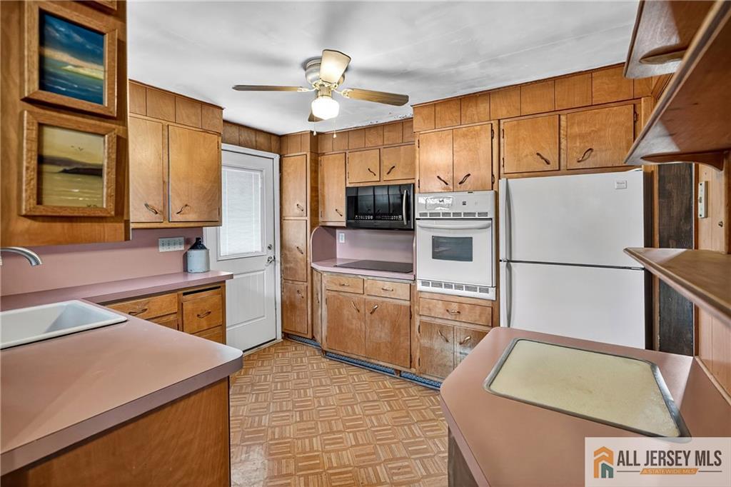 529 4th Street Dunellen, NJ 08812 - Photo 10 of 25 a kitchen with stainless steel appliances granite countertop a sink a stove cabinets counter space and stainless steel appliances
