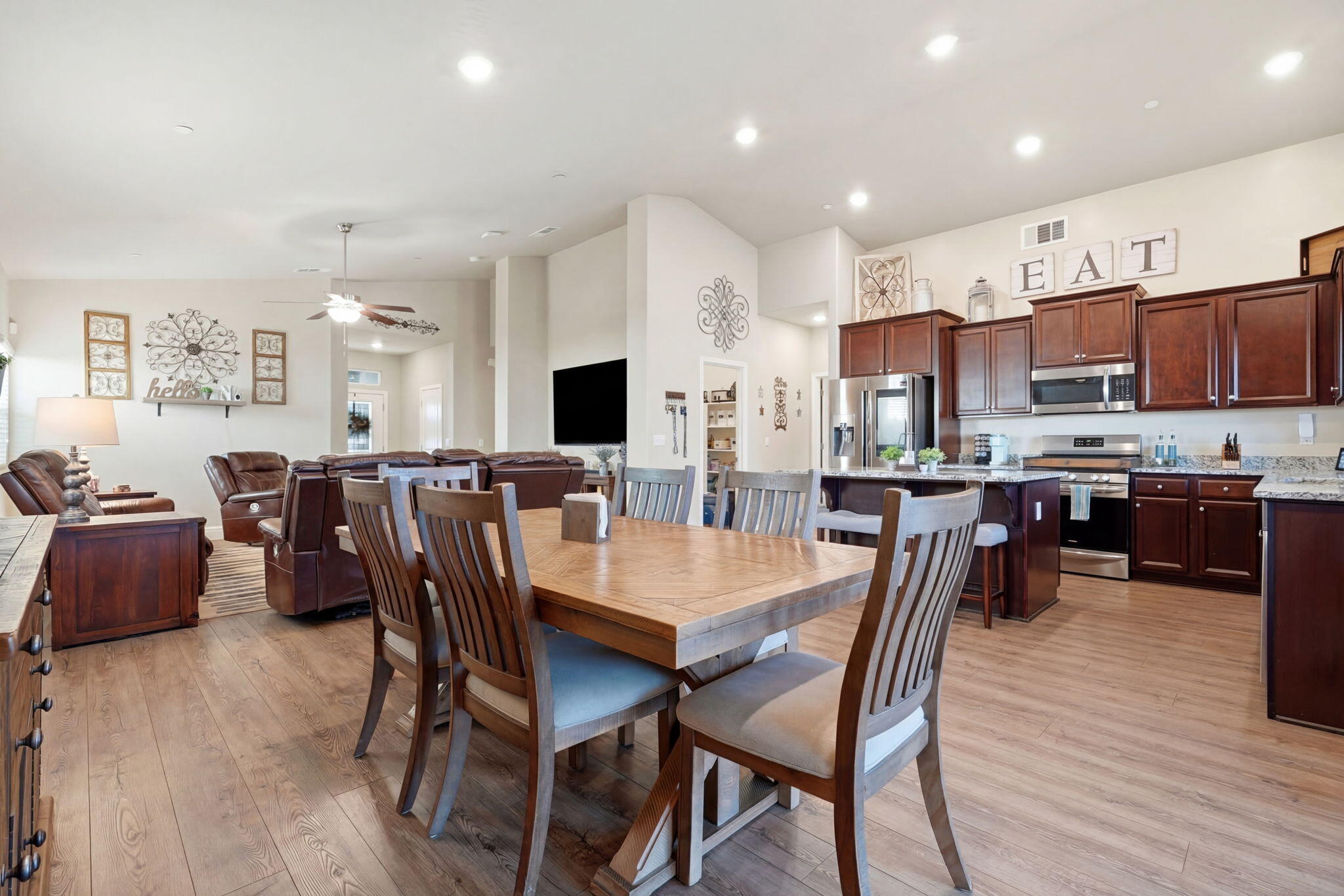 756 Strada Street Lemoore, CA 93245 - Photo 20 of 53 a view of a dining room with furniture and wooden floor