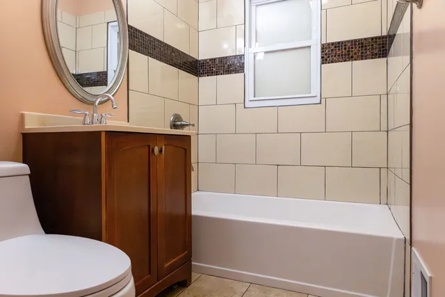 a bathroom with a sink a toilet and bathtub