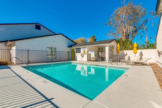 a view of a house with pool table and chairs