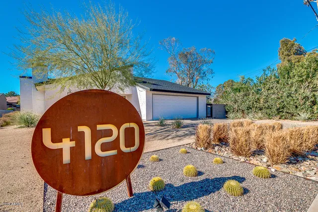 a view of backyard with a sink and a fire pit