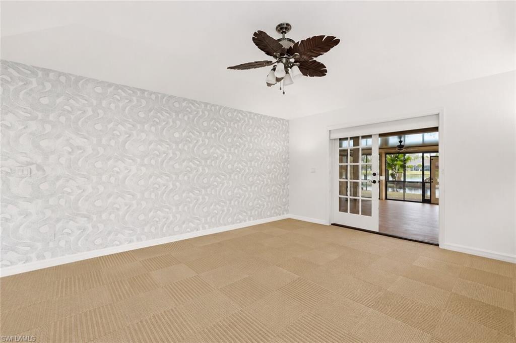 2274 Queens Way Naples, FL 34112 - Photo 14 of 28 a view of an empty room with a window
