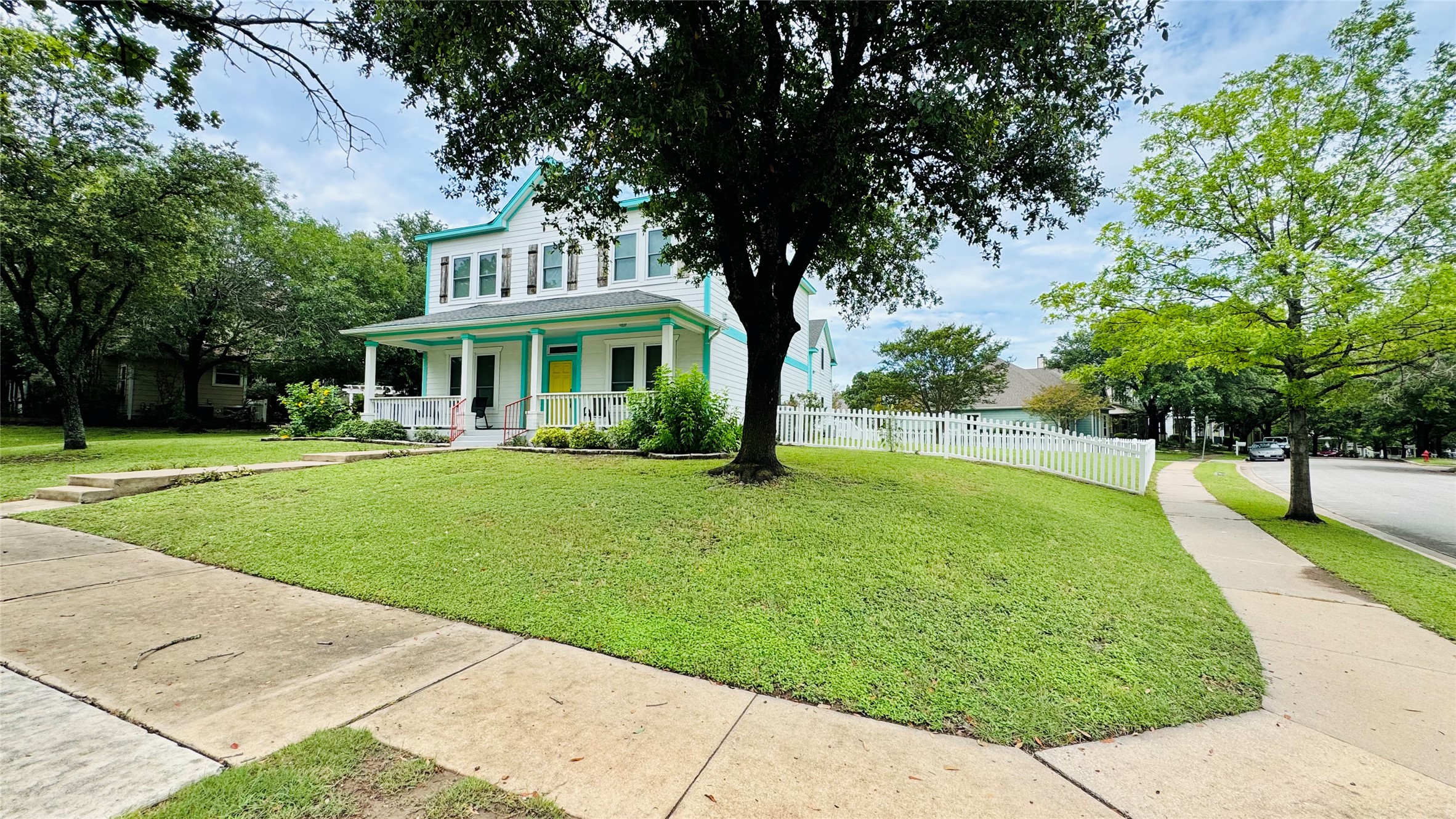 401 Witte Road Kyle, TX 78640 - Photo 1 of 9 A classic facade with a deep porch invites, complemented by a pristine white picket fence.