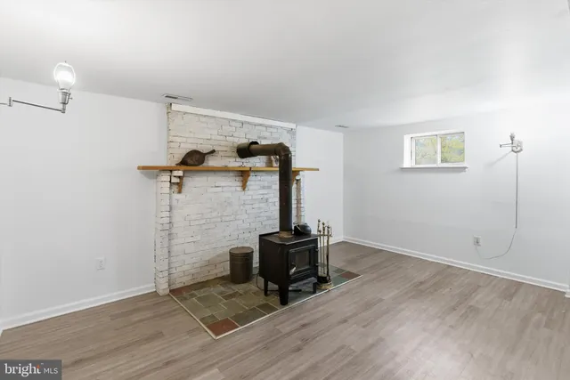 a room with a chair and wooden floor