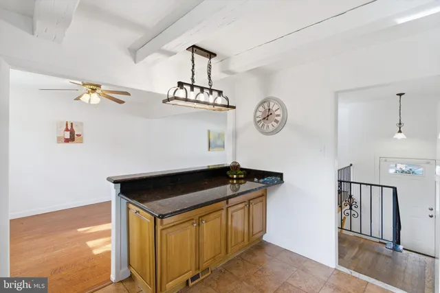 a view of storage and utility room with racks on the wall
