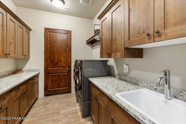 a roof deck with table and chairs a barbeque with wooden floor